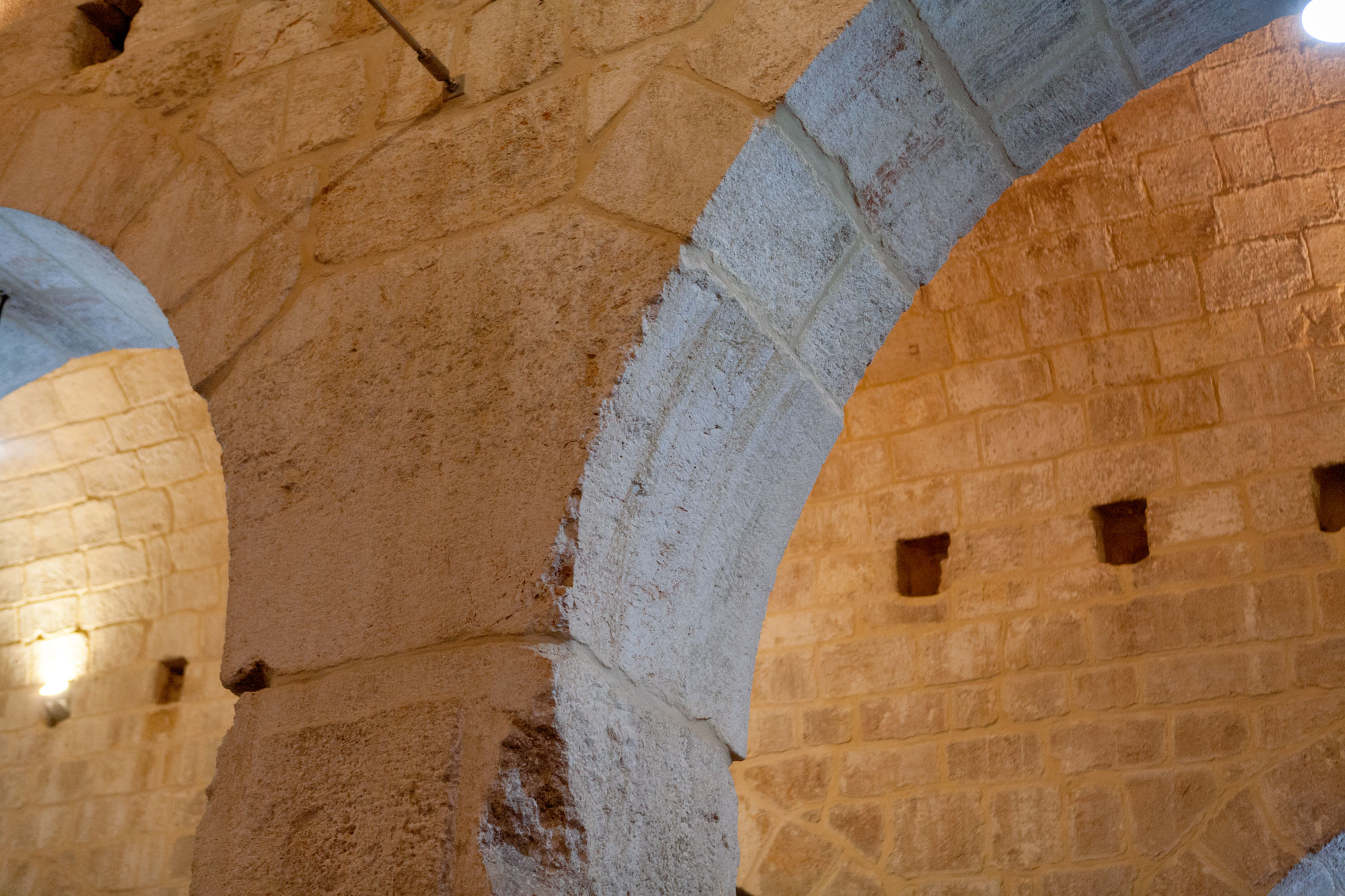 Spandrel of arcade with putlog holes.