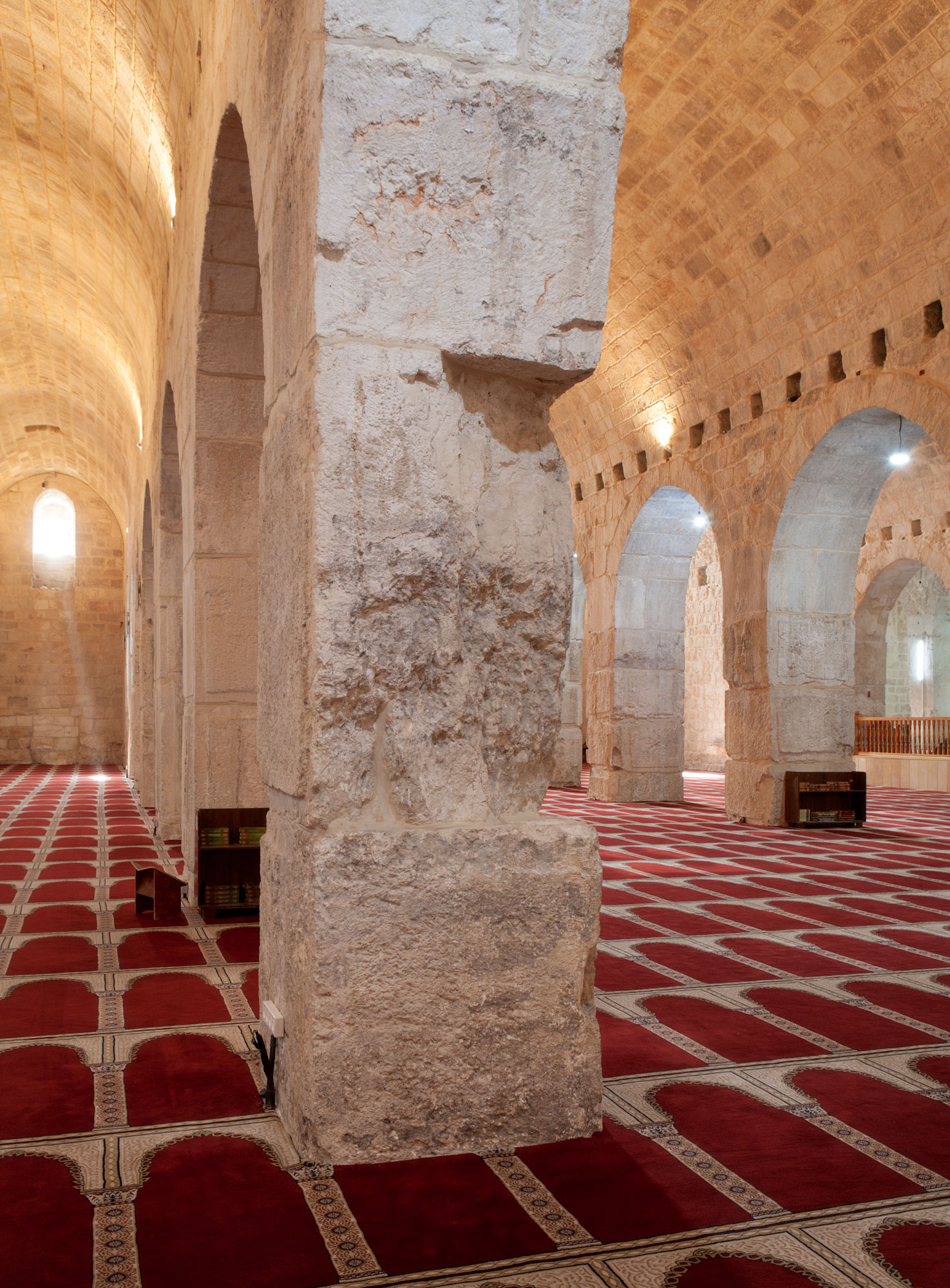 Three-point vertical view SSW with God's rays and  chipped and broken pier blocks, from Aisle 4. 