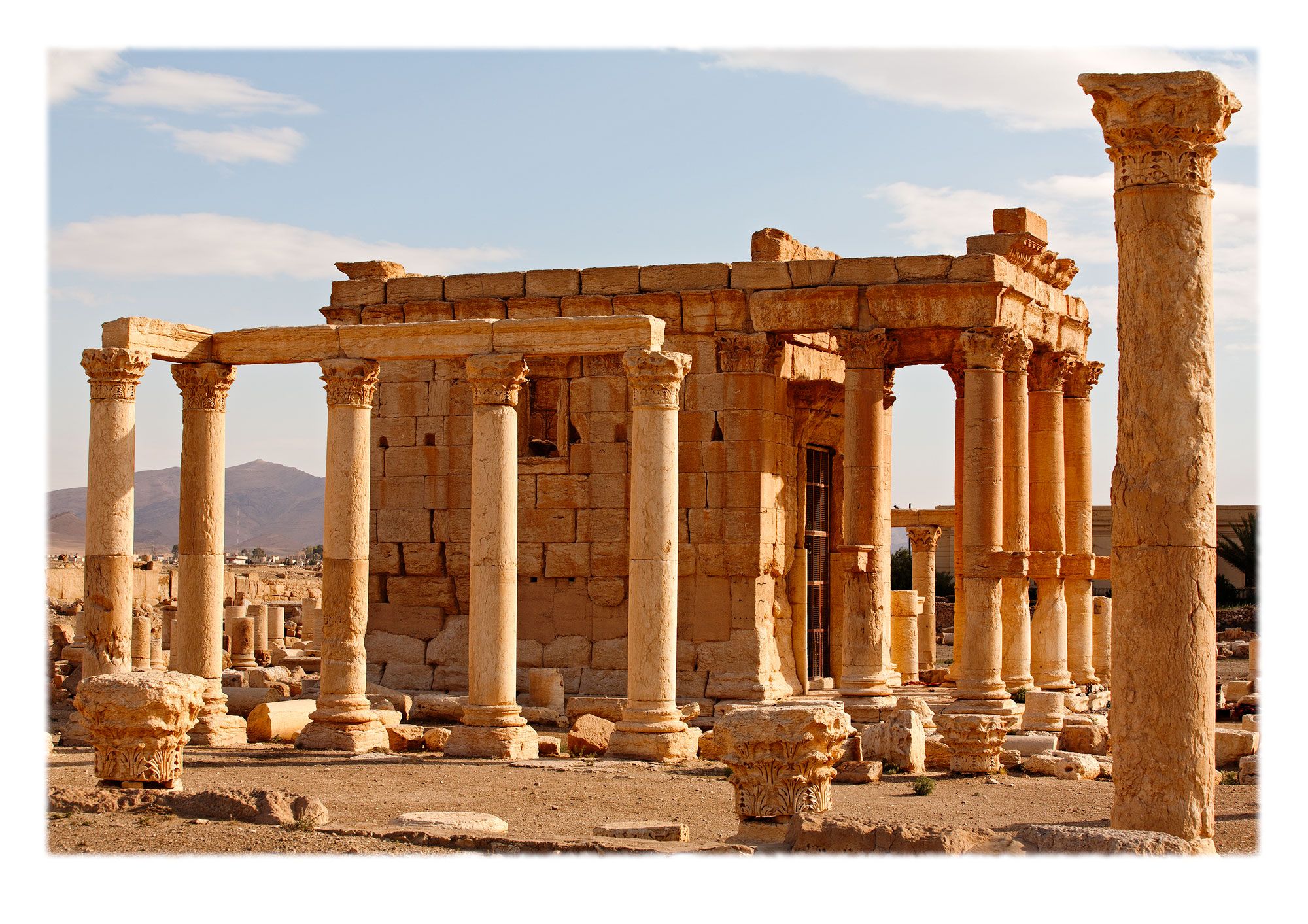 View from the southeast showing the portico and naos, or cella, surrounded by the remains of a peristyle courtyard. First built in 17 CE.