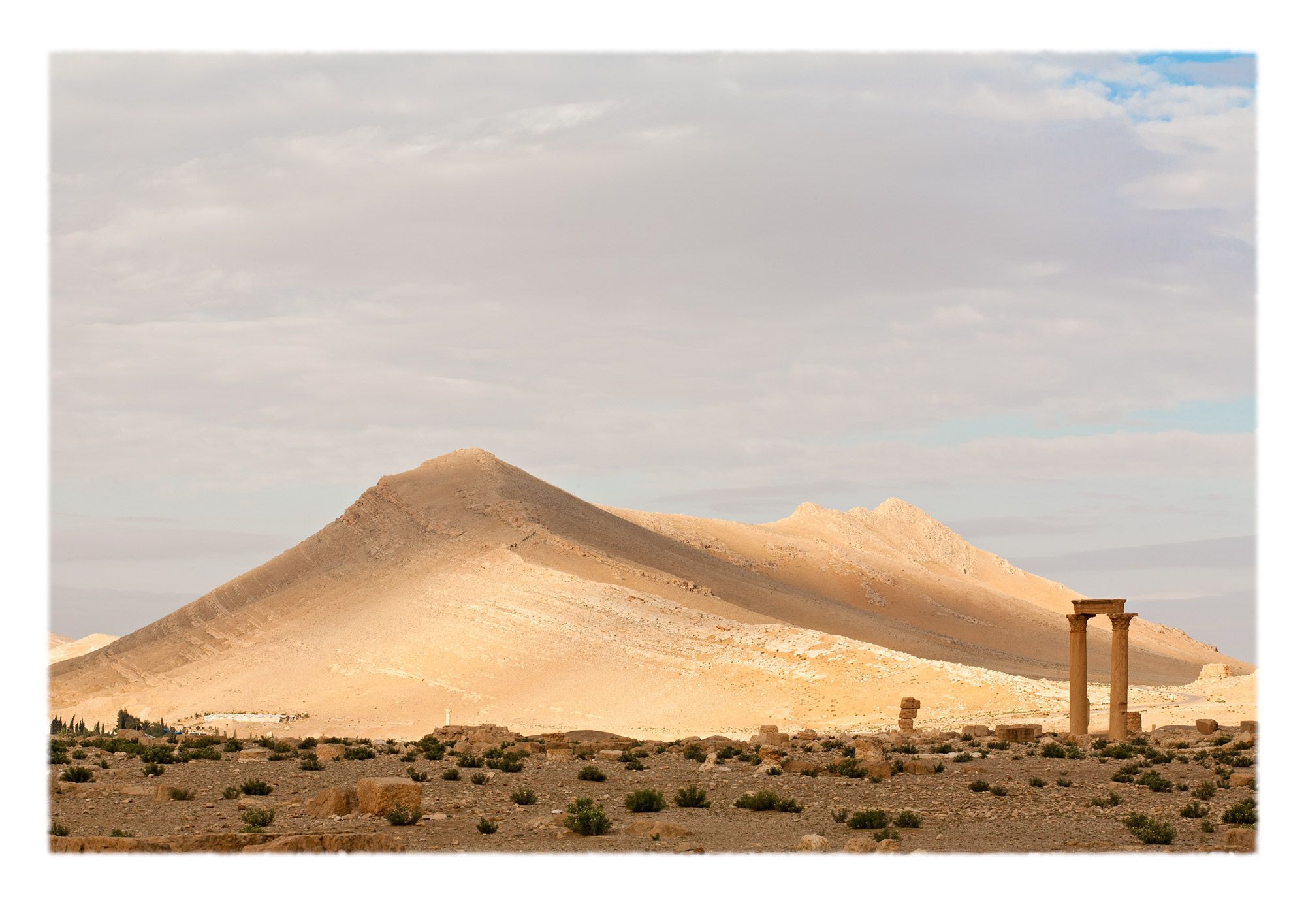 Palmyra is a Greek translation of "Tadmur", the local name for the oasis, which means 'palm tree' in Aramaic. This view south from the outskirts of the archaeological ruins toward the desert.