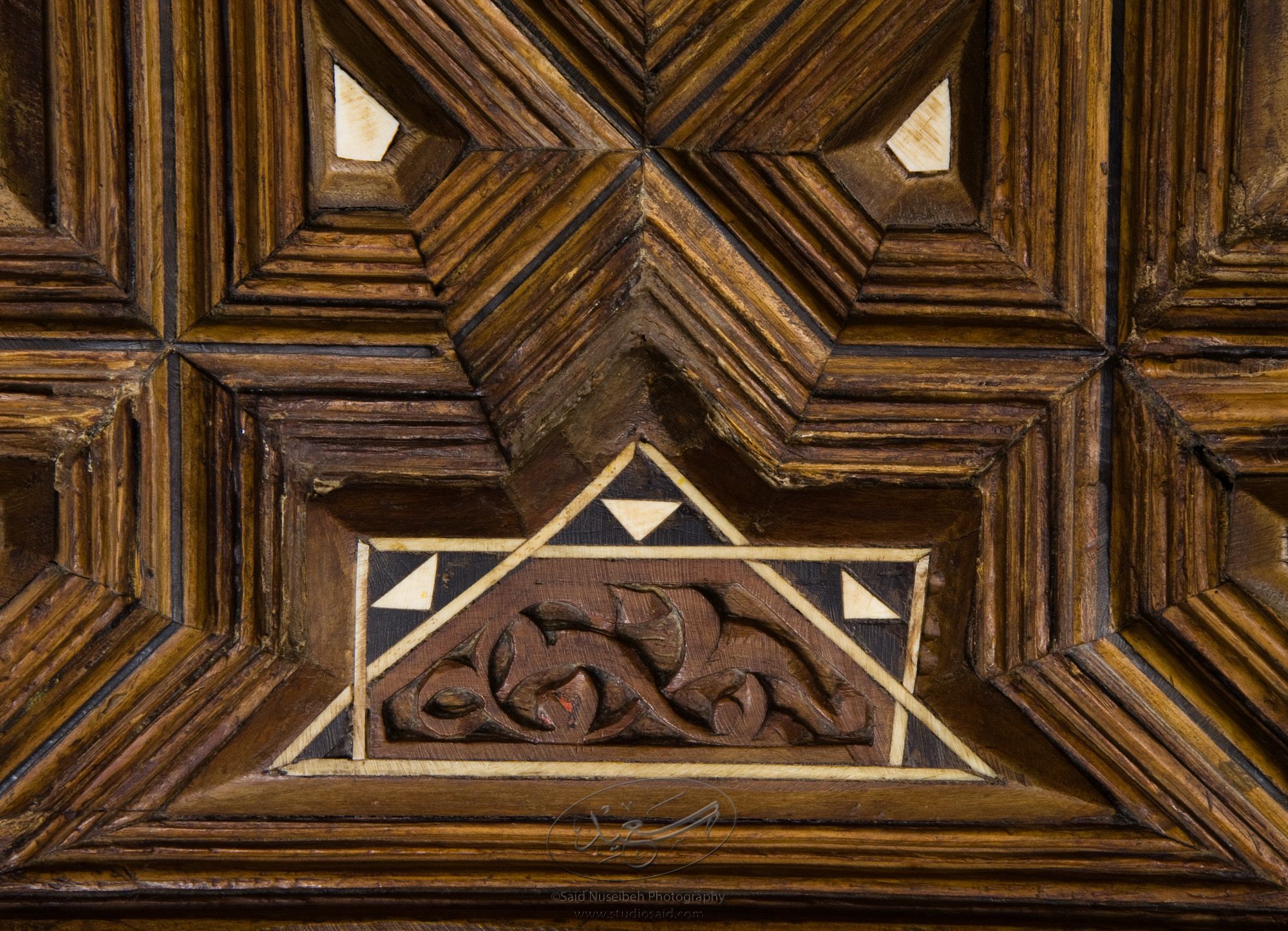 "Chipped Floral Design. Minbar, Carved Woodwork and Inlay Detail"The late-13th / early-14th c. Mamluk minbar, or pulpit, of Sultan al-Nasir Muhammad, the ninth Mamluk Sultan from Cairo and son of Qalawun. The minbar was located in the Umayyad Mosque in Aleppo, Haleb, prior to its damage and disappearance in May 2013.