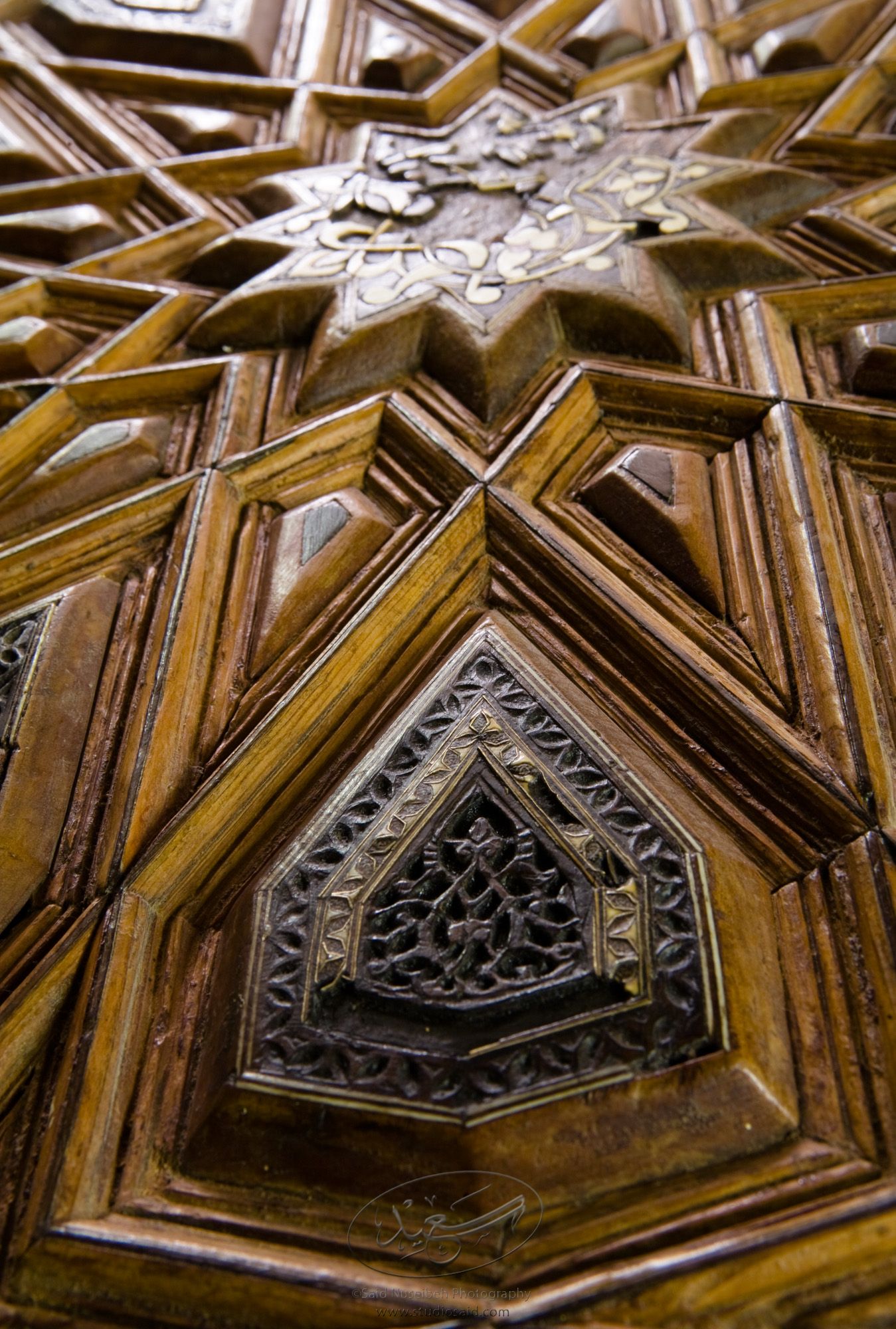 "Broken Star and Interlace Lozenge. Minbar, Carved Woodwork and Inlay Detail"The late-13th / early-14th c. Mamluk minbar, or pulpit, of Sultan al-Nasir Muhammad, the ninth Mamluk Sultan from Cairo and son of Qalawun. The minbar was located in the Umayyad Mosque in Aleppo, Haleb, prior to its damage and disappearance in May 2013.