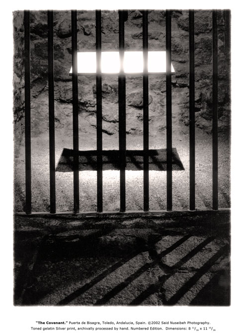 Floating and glowing stone tablet behind bars.